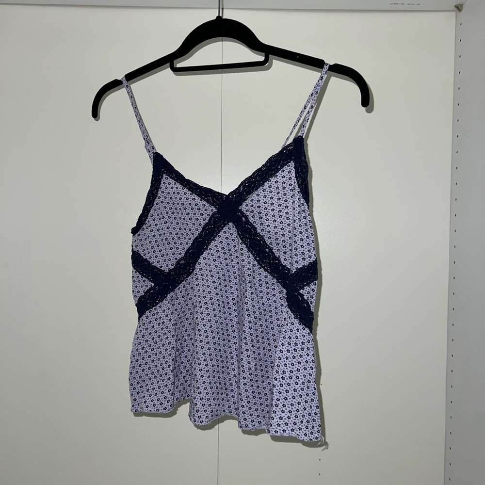 Super comfy Aerie top. fits a smaller chest best. small tear but an easy fix